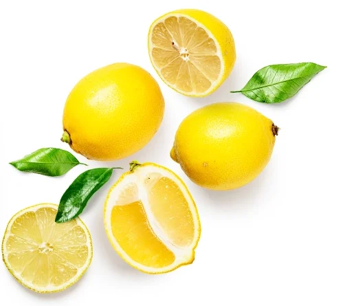 Four yellow lemons and green leaves, one lemon halved, displaying a juicy interior against a white background.